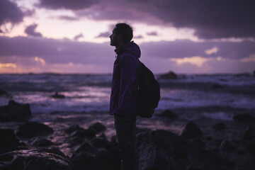 Silhouette of man standing near sea