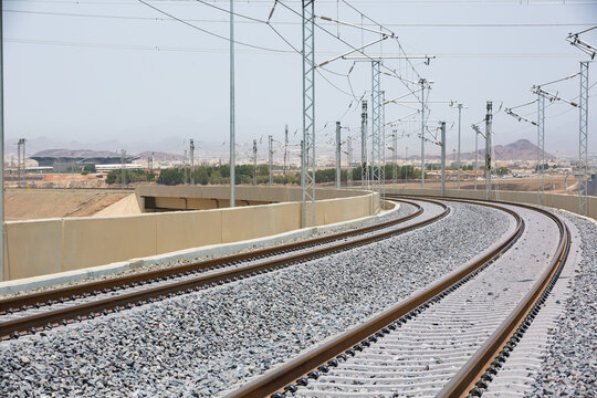 Railroad with powerlines under construction in summertime