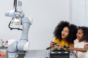 Kid teen child STEM Machine Learning Robot arm is Moving Under coding Control robot at stem...