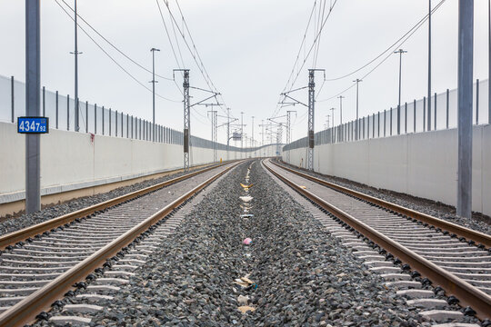 Railroad with powerlines under construction in summertime