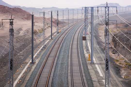 Railroad with powerlines under construction in summertime