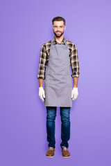Fototapeta premium Full size, fullbody portrait of handsome attractive carpenter with hairstyle in safaty glasses jeans, looking at camera isolated on grey background