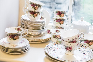 Set of vintage Chinese crockery with floral patterns at a teashop