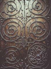Closeup shot of beautifully ornate metal scrollwork on a door at York Minster
