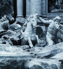 Cherub and winged water horse statues emerging from the Trevi Fountain in Rome, Italy