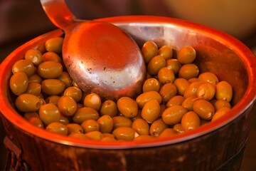 Closeup of green olives on sale at the French Market at Bicester