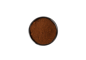 Ground coffee in a bowl isolated on white background.