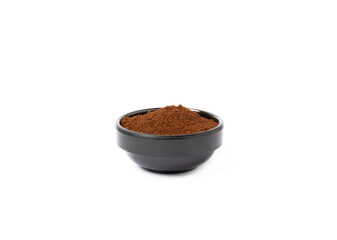 Ground coffee in a bowl isolated on white background.