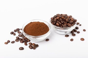 Bowl of ground coffee and beans isolated on a white background.