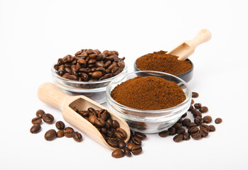 Bowl of ground coffee and beans isolated on a white background.