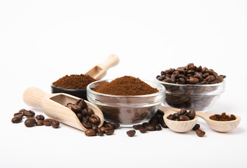 Bowl of ground coffee and beans isolated on a white background.