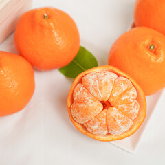 Ripe mandarin with leaves close-up on a white background. tangerine orange with leaves on a white background
