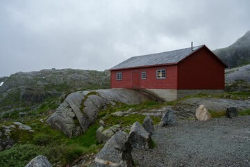 Old painted red barn on Sauda Mountain in Norway