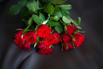 Bunch of red roses on dark background