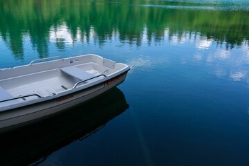 Boat in a lake in the Grisons Mountains in Switzerland