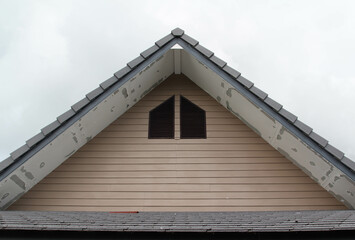 Single gable roof on blue sky background © noomcm
