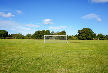soccer field in public park. goals with nets for football matches or practice. sports football pitch 