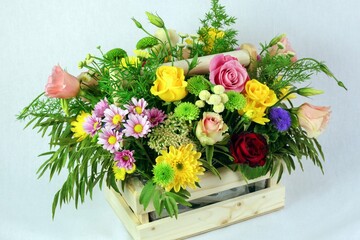 Delightful bouquet of freshly picked flowers presented in an elegant wooden box