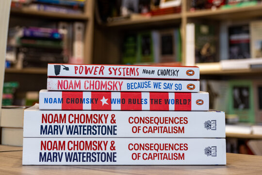 Close-up a stack of books by Noam Chomsky in the bookshop.
