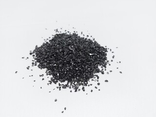 Anthracite commonly used in the water filtration to remove impurities and improve water quality. Anthracite known as hard black coal is acompact variety of coal. Isolated on white background