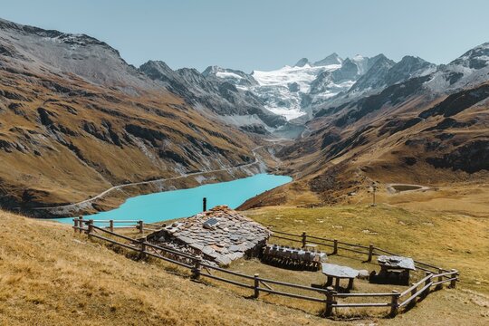 Swiss chalet in a meadow overlooking the Lake and Glacier of Moiry