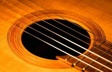 Obraz premium Closeup shot of details on a wooden brown acoustic guitar