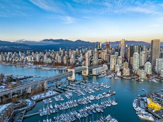 Naklejka premium Aerial shot of the beautiful Vancouver city in Canada with many skyscrapers during the winter