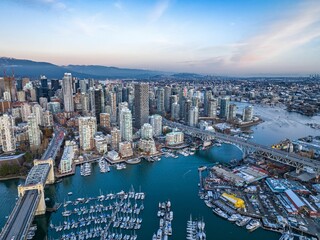 Fototapeta premium Aerial shot of the beautiful Vancouver city in Canada with many skyscrapers during the winter
