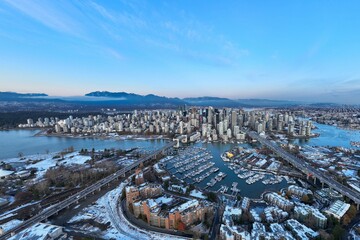 Aerial shot of the beautiful Vancouver city in Canada with many skyscrapers during the winter