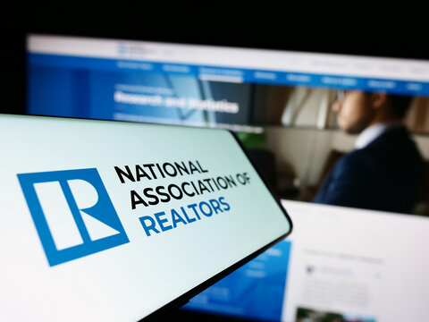 Stuttgart, Germany - 03-17-2023: Smartphone with logo of American National Association of Realtors (NAR) on screen in front of website. Focus on center-left of phone display.