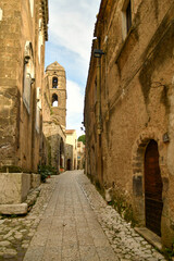 Fototapeta na wymiar Narrow street among the old stone houses of the oldest district of the city of Caserta