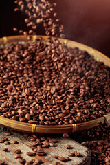 Medium-roasted coffee beans are poured into a basket.