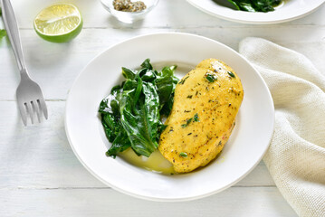 Baked turmeric chicken breast and sauteed spinach