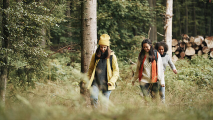 Friends hiking through the woods