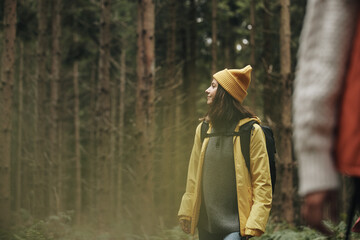 Woman hiking in a forest with a friend