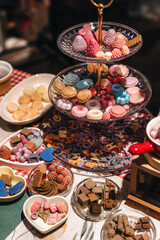 Candy cookies and sweets on a three-tier stand
