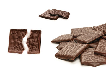 Dark chocolate candies isolated on white background.