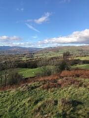 Mountain View with rugged countryside and  a dramatic blue sky background. Cumbria England. 