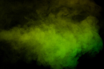 Yellow and green steam on a black background.