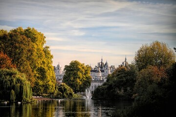 Fototapeta na wymiar Splendid architecture of Westminster, central London captured from St James's park with leafy trees