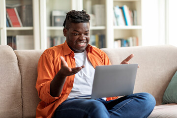 Chatty african american guy have video conference from home