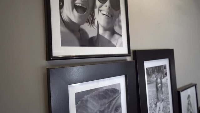 Wall with photos of the family in various photo frames