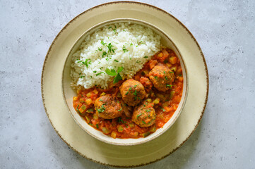 view from above of a plate of meatballs with rice