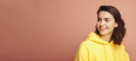 Beautiful young brunette woman in big headphones headset listening to music and smiling. Wide banner with copy space generative ai