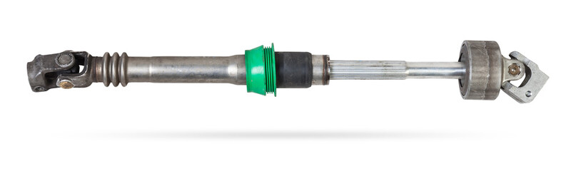 The spare part of the car is a metal steering propeller shaft with hinges on a white background with inscriptions designating the model. Repair of equipment at the auto-parsing in the workshop.