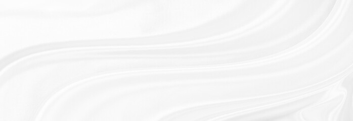 White gray satin texture that is white silver fabric silk panorama background with beautiful soft...