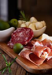 typical Italian antipasto platter with cold cuts and cheeses