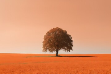  a lone tree stands alone in a field of orange grass.  generative ai