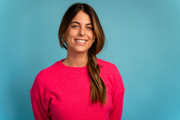 Smiling woman in sweater looking at camera