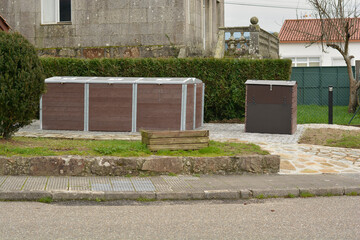 Community composter placed in a common residential area to recycle and reduce the organic waste produced in apartments. Concept of recycling and sustainability